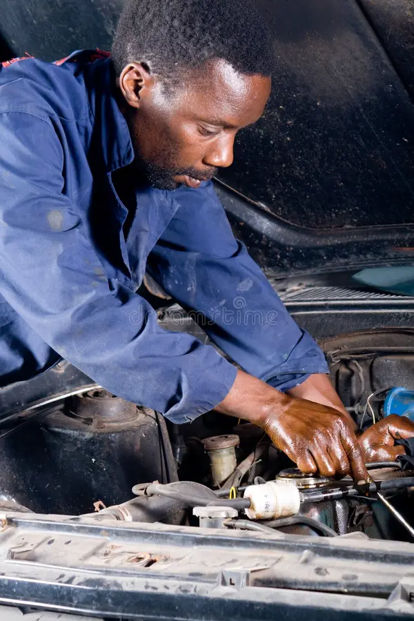 Mechanic working on car